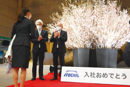 A red carpet and cherry blossoms in full bloom welcome new hires.